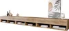 A long, wooden TV cabinet with open shelves, decorated with vases and a framed picture. Voir les images du produit