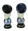 Two decorative owl figurines with witch hats, displayed side-by-side against a white background. Produktbild-Vorschau