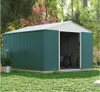 A green metal shed with a white roof sits in a grassy yard with trees and pink flowers in the background. A bicycle is visible inside the open shed. Produktbild-Vorschau
