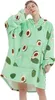 Frau trägt einen übergroßen hellgrünen Fleece-Kuschelhoodie mit Avocado-Print und bedeckt mit einer Hand ihre Augen Produktbild-Vorschau