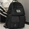 A black backpack is shown in a studio setting. Náhľad obrázku produktu