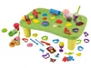 A play table with various clay molding tools and accessories scattered around it. Produktbild-Vorschau