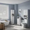 A modern bathroom with a bathtub, toilet, and several white storage cabinets. Produktbild-Vorschau