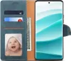 A flip-case phone cover with a phone inside, showing a baby's photo and cash. Podgląd zdjęcia produktu