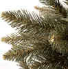 A close-up view of artificial pine needles on a Christmas tree branch. Voir les images du produit