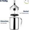 A disassembled milk frother, showing the container and the lid with the whisk mechanism. Produktbild-Vorschau