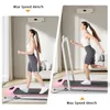 A woman is shown using a pink treadmill in a home setting, with an air conditioner visible on the wall. Produktbild-Vorschau