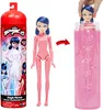 A doll and its packaging are shown, with an arrow indicating a transformation process. Náhled obrázku produktu