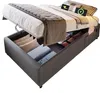 A bed with storage underneath, showing its lifted mechanism. Voir les images du produit