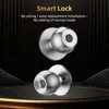 A product image showcasing two smart door knobs against a dark, textured background with golden accents. Podgląd zdjęcia produktu