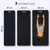 Three yoga mats of different sizes are displayed side-by-side, with one mat showing a person in a yoga pose. Text indicates the different sizes. Podgląd zdjęcia produktu