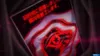 A close-up of a digital screen displaying Japanese text and a stylized red eye symbol. Produktbild-Vorschau