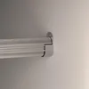 A close-up view of a metal rod attached to a wall with a bracket. Anteprima dell’immagine prodotto