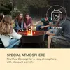 A group of young people are gathered around a fire pit, roasting marshmallows. Produktbild-Vorschau