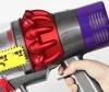 A hand holds a vacuum cleaner part, showing a close-up of the trigger and cyclone mechanism. Produktbild-Vorschau