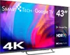 A Smart-Tech 43-inch 4K Ultra HD Google TV is displayed with its screen showing a colorful abstract image. The TV is mounted on a stand. Náhľad obrázku produktu
