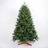 A green artificial Christmas tree on a wooden stand against a white background. Produktbild-Vorschau