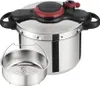 A stainless steel pressure cooker with a steamer basket in front of it, set against a white background. Podgląd zdjęcia produktu