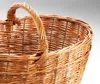 A close-up shot of a woven basket with a handle. Podgląd zdjęcia produktu