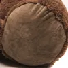 A close-up view of the bottom of a brown teddy bear's foot. Voir les images du produit