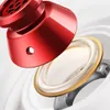 A close-up, exploded view of a red earbud speaker and its internal components. Produktbild-Vorschau