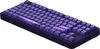 A dark purple mechanical gaming keyboard with a unique marbled purple spacebar and accent keys, shown from a slightly elevated diagonal angle against a white background. Produktbild-Vorschau