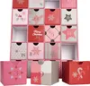 A pink advent calendar with 24 drawers, decorated with Christmas motifs and numbers. Náhled obrázku produktu