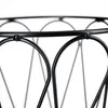 A close-up view of the top edge of a black metal basket with a decorative wire pattern. Náhľad obrázku produktu