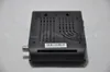 The back of a black satellite receiver is shown on a light gray surface. Náhled obrázku produktu