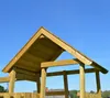 The image shows the wooden roof of a playground structure against a clear blue sky. Podgląd zdjęcia produktu