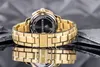 A close-up shot of the back of a gold Maserati watch, showing the clasp and bracelet, with a reflective surface and slate-like background. Náhled obrázku produktu