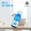 An ink bottle is placed on a desk next to a laptop and a glass of water, with a window in the background. Produktbild-Vorschau