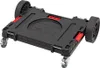 A black transport platform with wheels, shown from a diagonal angle. Produktbild-Vorschau