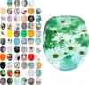 A collage of various toilet seat designs and a large image of a toilet seat with a daisy pattern. Produktbild-Vorschau