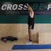 A man is performing an exercise with resistance bands in a gym. Náhled obrázku produktu