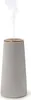 A gray aroma diffuser with a gold rim emitting a stream of vapor. Náhled obrázku produktu