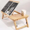 A wooden laptop table with a magazine and a mug on it. Podgląd zdjęcia produktu
