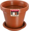 A terracotta-colored plastic plant pot with a matching saucer, shown against a white background. A label is attached to the front of the pot. Podgląd zdjęcia produktu