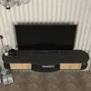 A modern TV lowboard mounted on a wall with a television on top. Podgląd zdjęcia produktu