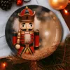 A festive Christmas scene with a nutcracker figurine on a decorative plate, surrounded by pine needles and Christmas lights. Produktbild-Vorschau