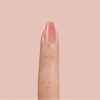 A close-up of a finger with a pink nail polish. Anteprima dell’immagine prodotto