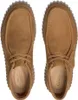 A top-down view of a pair of brown Clarks clogs on a white background. Voir les images du produit