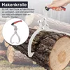 A hand holding a log grabber tool over a pile of logs. Produktbild-Vorschau