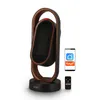A smart heater with a remote control and a smartphone displaying the Tuya app. Anteprima dell’immagine prodotto