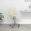A cream-colored office chair with a chrome base and wheels is shown in a room with a white wall and light gray floor.