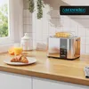 A modern kitchen counter scene with a toaster, croissant, orange, and juice. Produktbild-Vorschau