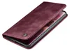 A burgundy flip case for a smartphone is shown from a diagonal angle, with the cover partially open to reveal the phone screen. Produktbild-Vorschau