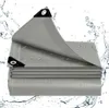 A folded grey tarp with water droplets on it, surrounded by splashing water. Produktbild-Vorschau