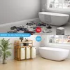 A split image showing a messy bathroom floor with clothes scattered around in the top panel, and a tidy bathroom with a laundry basket and a bathtub in the bottom panel. Anteprima dell’immagine prodotto