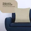 A decorative pillow on a blue sofa, with marketing text overlay. Produktbild-Vorschau